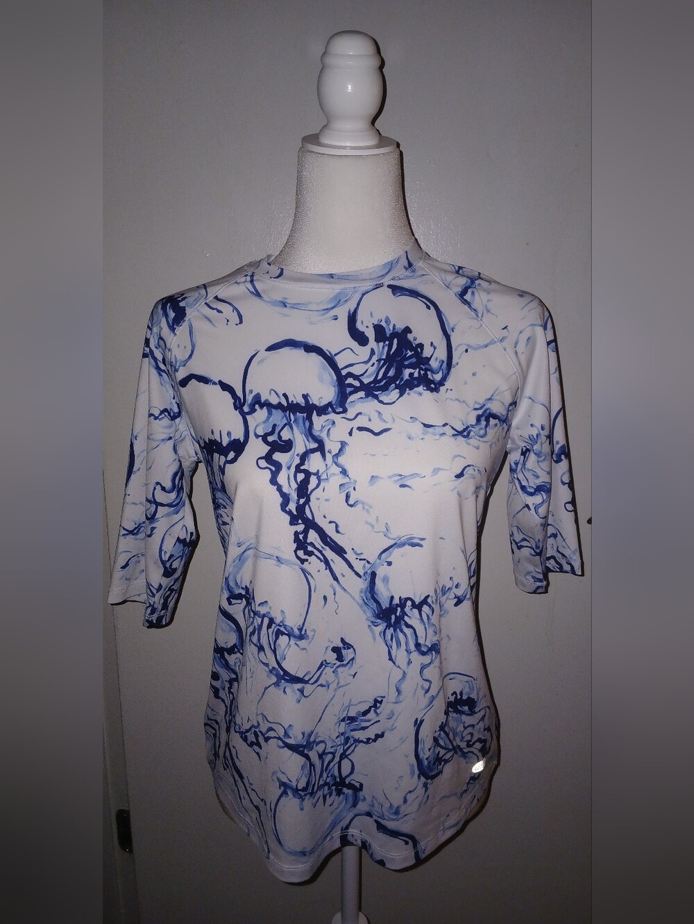 Reel Legends White Short Sleeve Performance Top with Blue Jellyfish Print